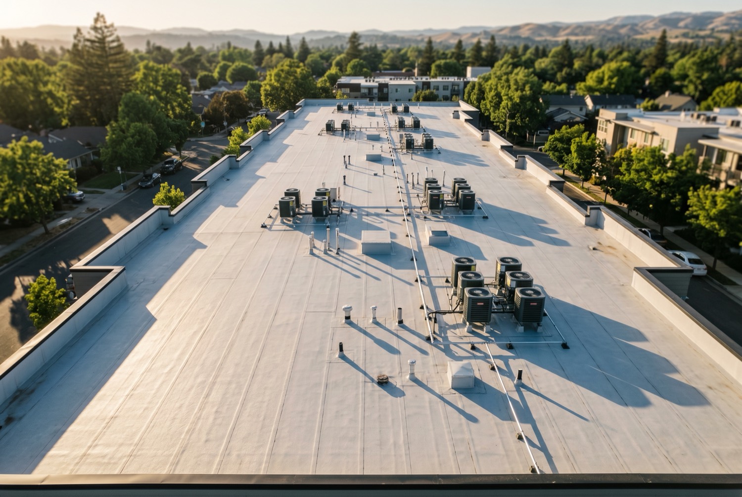 Aerial view of a newly installed commercial flat roof on an apartment building